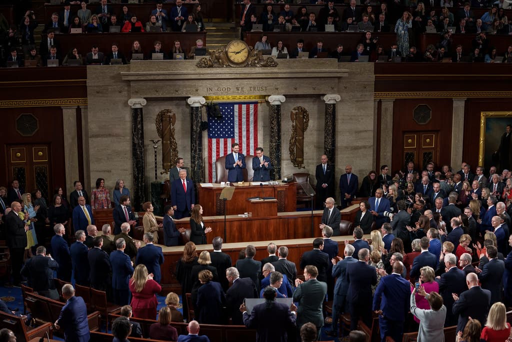 Wide view of the House chamber during President Trump's 2026 State of the Union address with Congress standing and applauding
